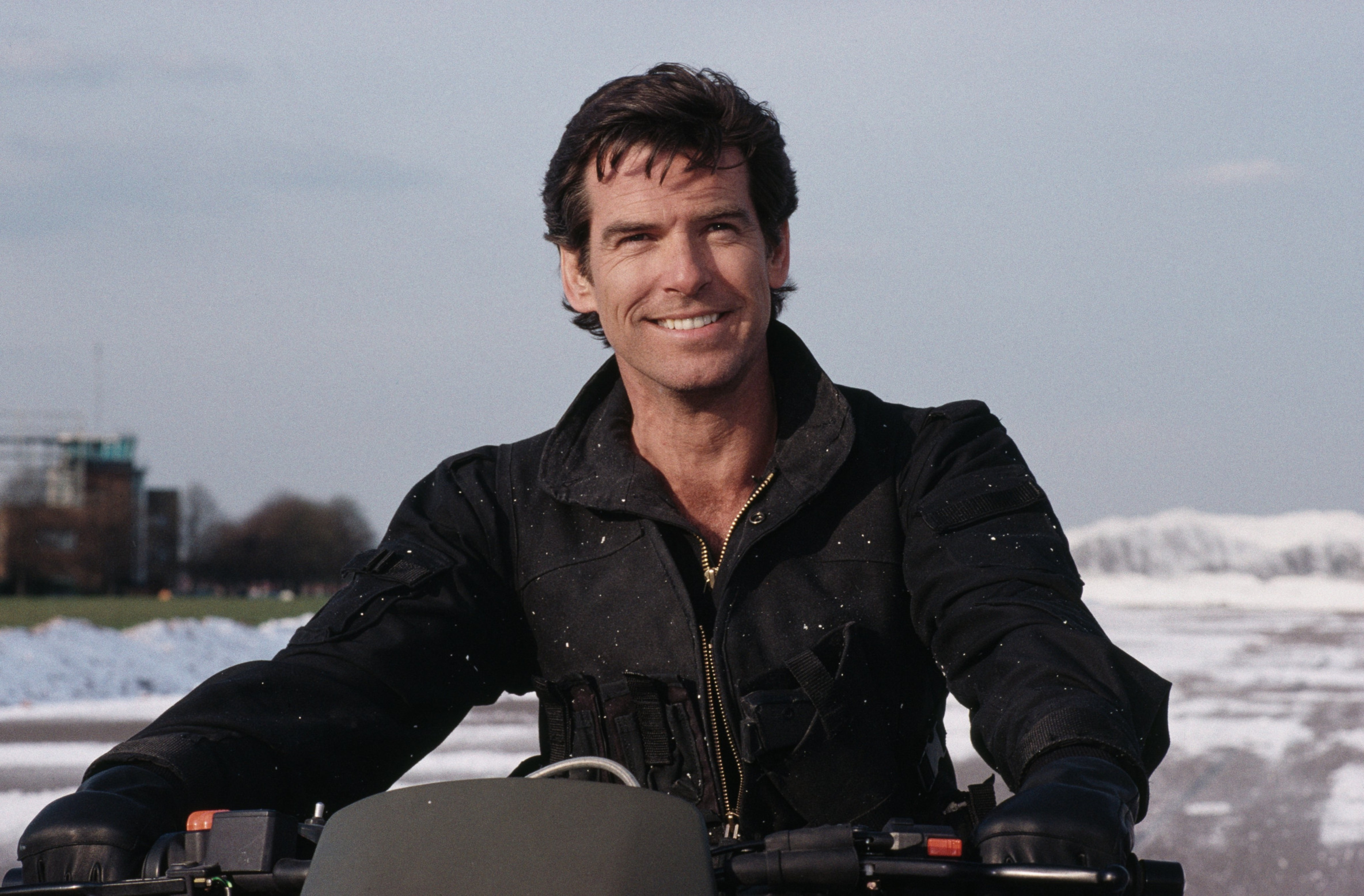 James Bond on a motorcycle smiling Blank Meme Template