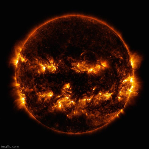 even the sun is getting into the spirit | image tagged in happy halloween from outer space | made w/ Imgflip meme maker