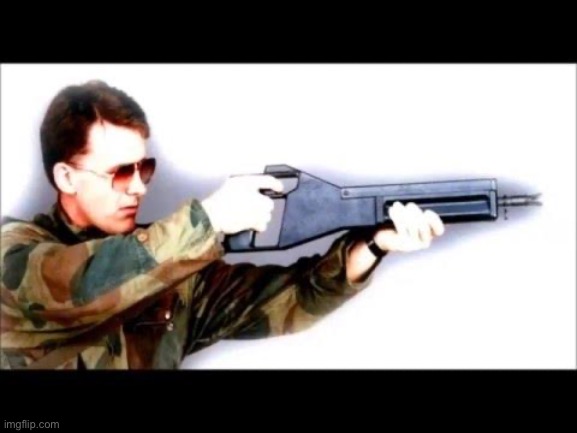 My dude looks like the antagonist minion who always dies in a car crash in those 90s action movies but his weapon is a handheld  | made w/ Imgflip meme maker