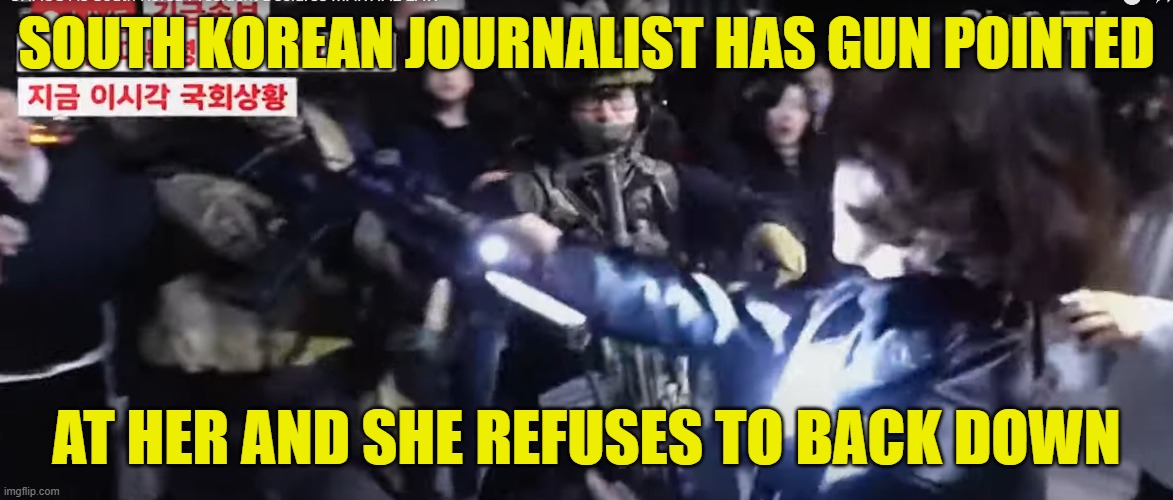 What real journalism looks like | SOUTH KOREAN JOURNALIST HAS GUN POINTED; AT HER AND SHE REFUSES TO BACK DOWN | image tagged in journalism,msnbc,cnn,fake news,patriot,south korea | made w/ Imgflip meme maker