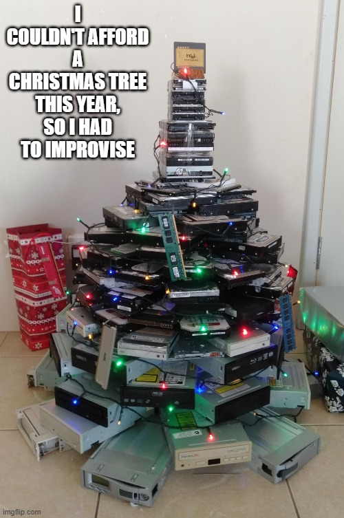 memes by Brad - I couldn't afford a Christmas tree this year, so I did this. | I COULDN'T AFFORD A CHRISTMAS TREE THIS YEAR, SO I HAD TO IMPROVISE | image tagged in gaming,gamer,christmas tree,video games,santa claus,computers | made w/ Imgflip meme maker