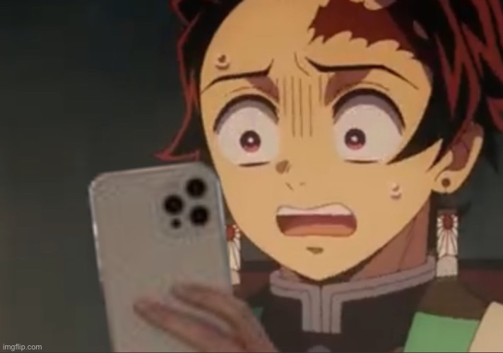 Tanjiro holding phone | image tagged in tanjiro holding phone | made w/ Imgflip meme maker