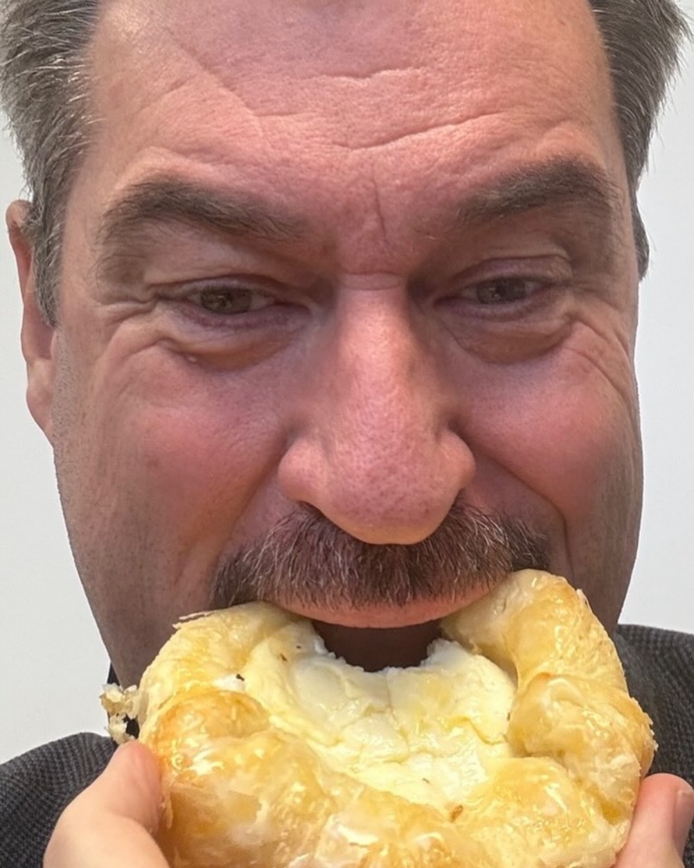 Markus Söder eating snack Blank Meme Template