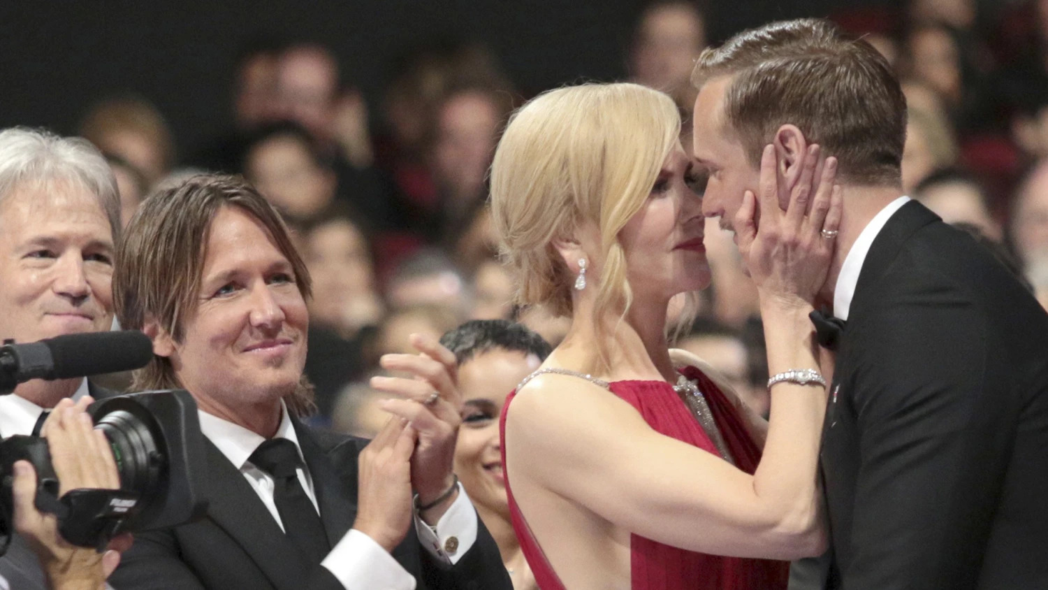 Kidman kissing Skarsgard while her husband cheers for them Blank Meme Template