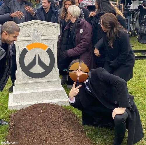 tf2 > overwatch | image tagged in guy posing in front of grave | made w/ Imgflip meme maker