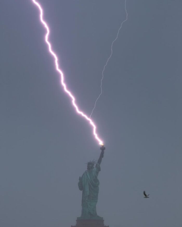 Photo credit: Dan Martland | image tagged in photography,statue of liberty,lightning | made w/ Imgflip meme maker