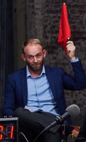 Jacob Hansen (Thoughtful Faith) holding red flag Blank Meme Template