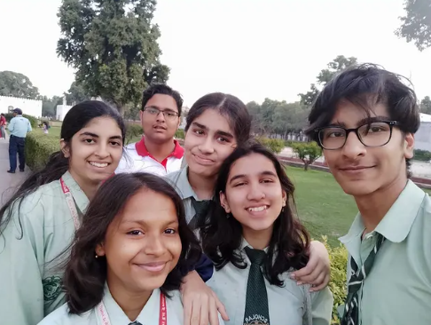 Boy in red shirt with classmates Blank Meme Template