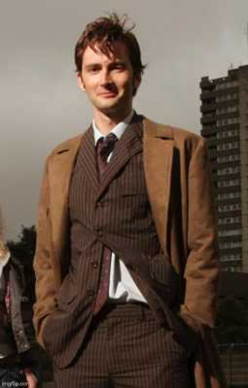 10th doctor happily standing on a building | image tagged in 10th doctor happily standing on a building | made w/ Imgflip meme maker