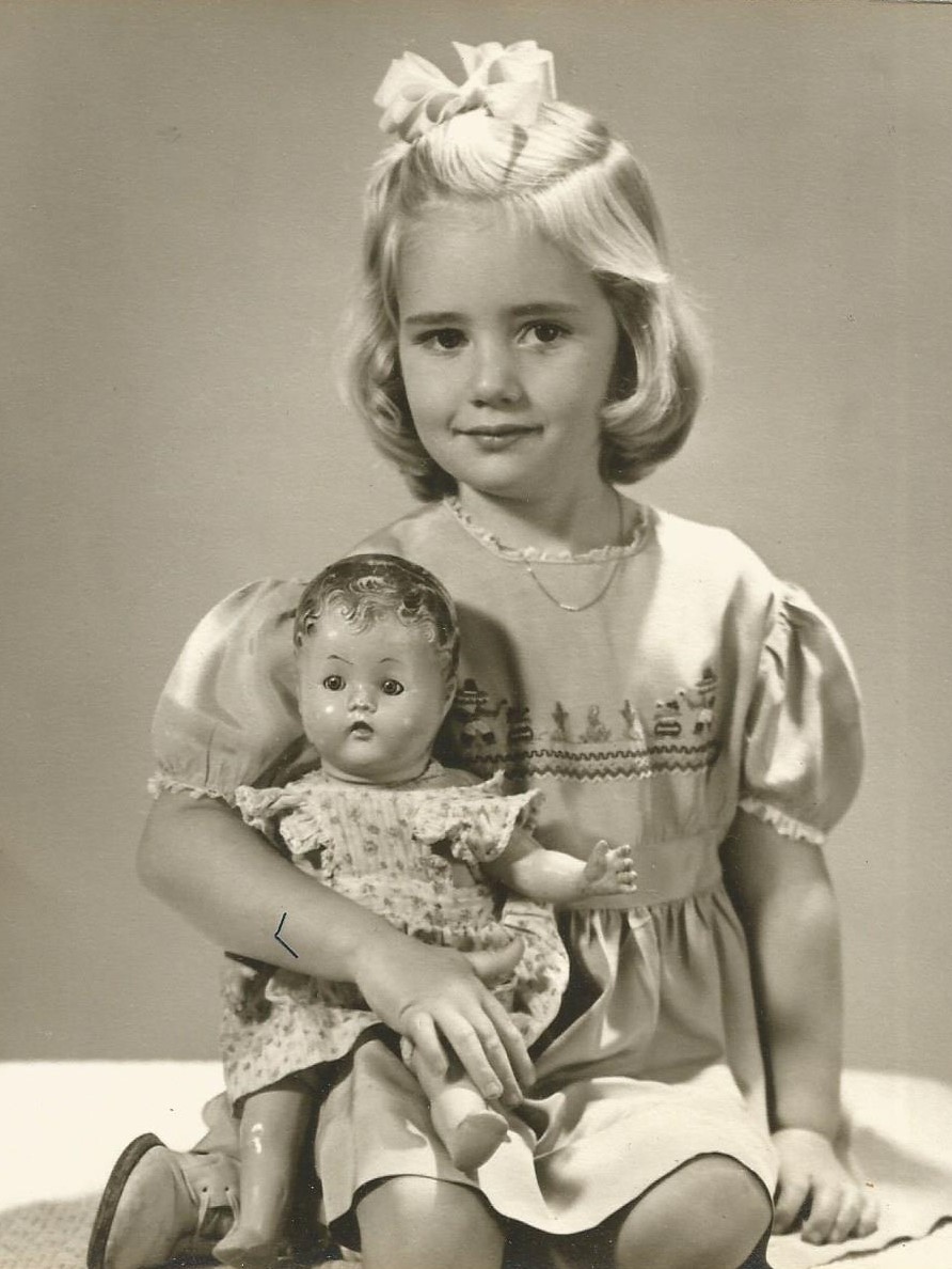 Little girl with doll Blank Meme Template