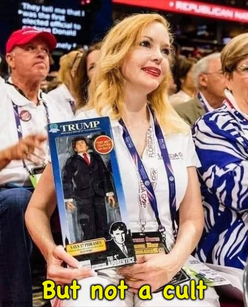 Trump supporter with doll | But not a cult | image tagged in trump supporter with doll | made w/ Imgflip meme maker