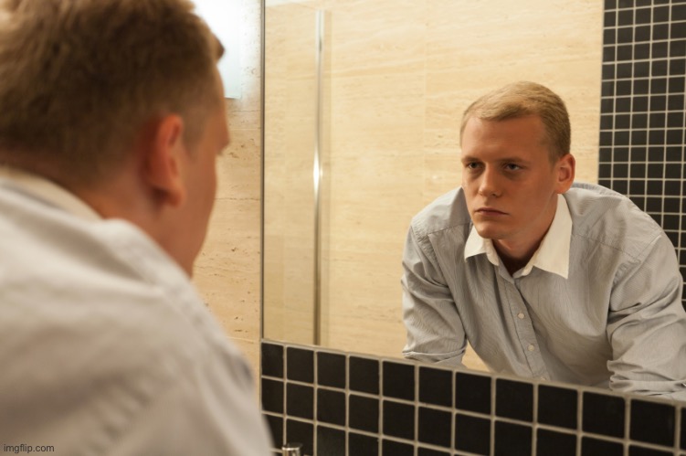 Man looking in mirror | image tagged in man looking in mirror | made w/ Imgflip meme maker