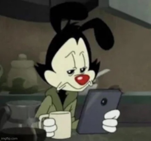 Yakko holding a phone | image tagged in yakko holding a phone | made w/ Imgflip meme maker