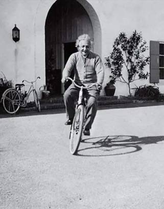 Einstein on a bicycle Blank Meme Template