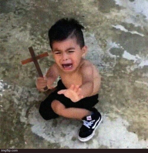 Scared kid with cross | image tagged in scared kid with cross | made w/ Imgflip meme maker