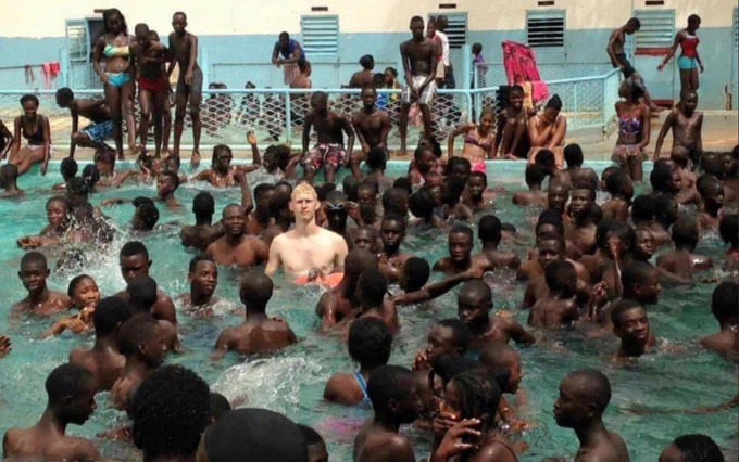 white guy in pool with blacks Blank Meme Template