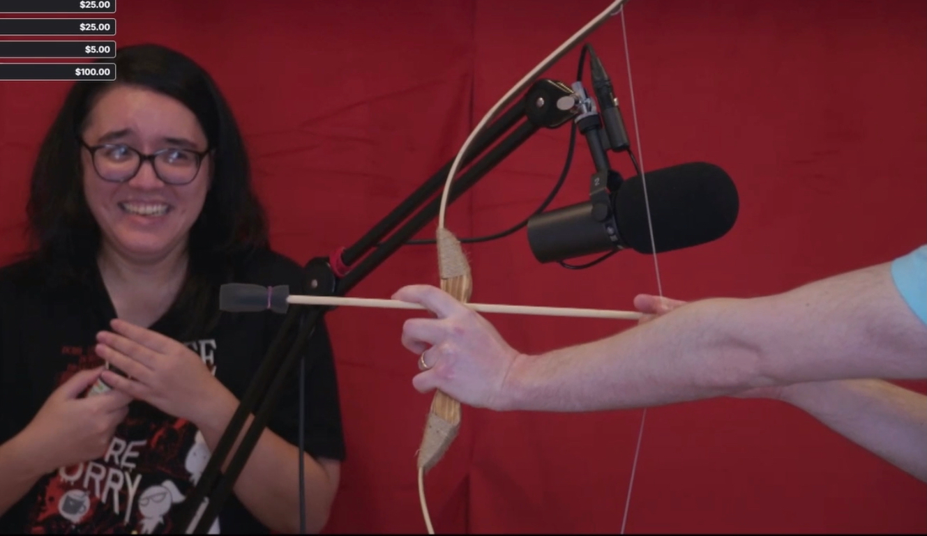 Nathan Drawfee pointing a bow at Karina Drawfee Blank Meme Template
