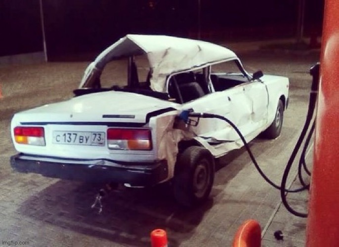Broken Lada Car at petrol station | image tagged in broken lada car at petrol station | made w/ Imgflip meme maker