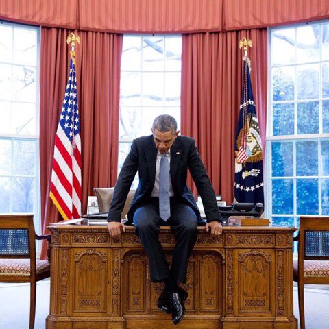 Obama sitting on desk Blank Meme Template