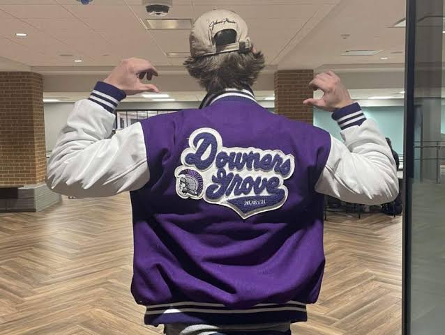 Pointing at back of Letterman jacket Blank Meme Template