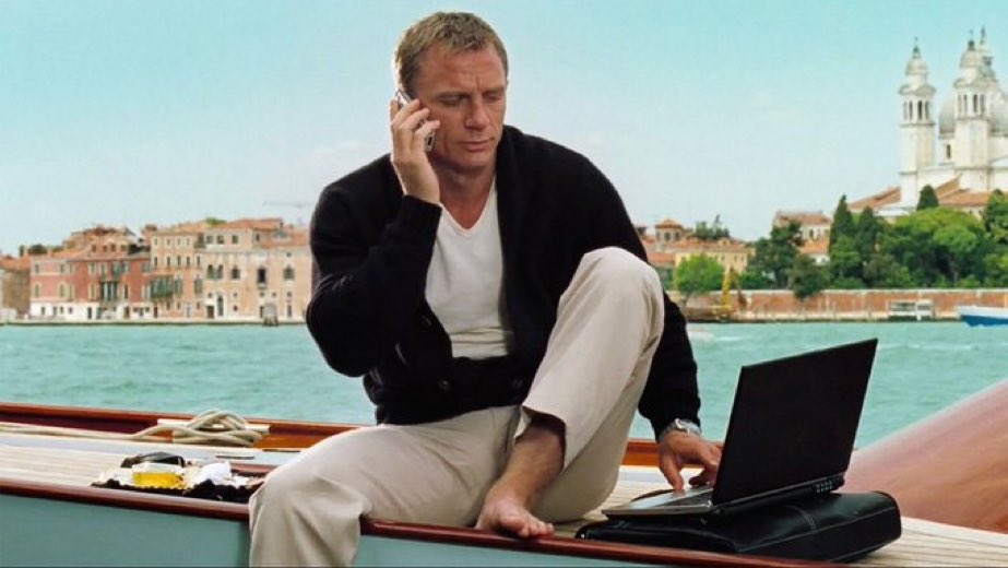 James Bond with a laptop on a yacht in Italy Blank Meme Template