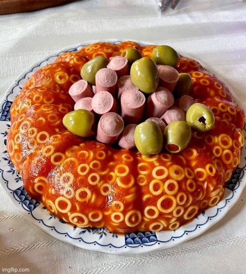 Spaghetti-Os bundt cake with Vienna sausages and green olives with pimentos in them. Stoner food? | image tagged in food,nasty food,dafuq,what the hell is this,oh hell no,stoner food | made w/ Imgflip meme maker