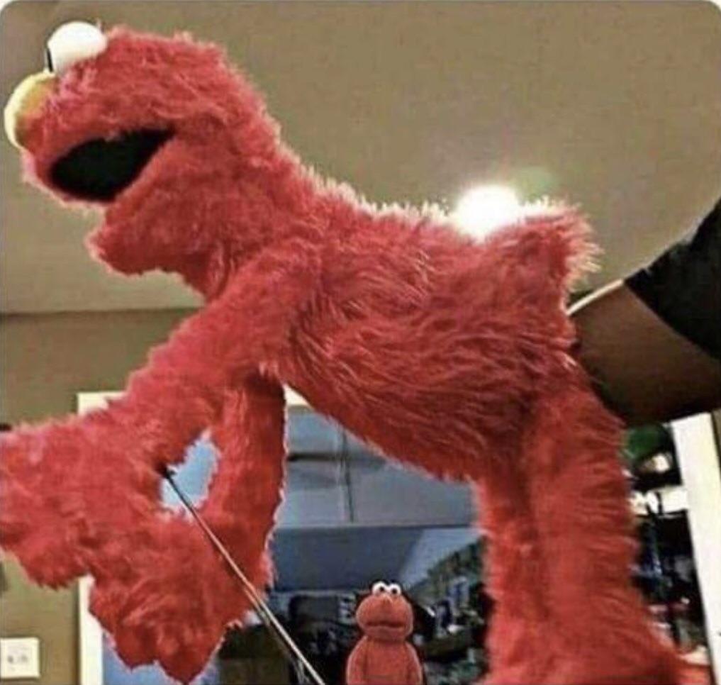 elmo stuffed while elmo watches Blank Meme Template