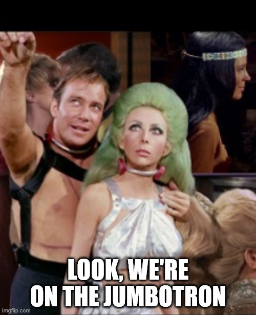 Look, we're on the Jumbotron | LOOK, WE'RE ON THE JUMBOTRON | image tagged in kirk and green hair lady,coldplay,jumbotron,oh wow are you actually reading these tags | made w/ Imgflip meme maker