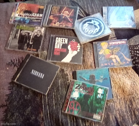 All my cds. My favourites are either clumsy from our lady peace or americana from the offspring | made w/ Imgflip meme maker