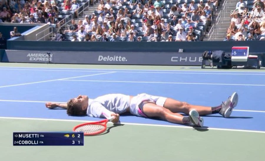 Cobolli lying exhausted on the court US Open Blank Meme Template