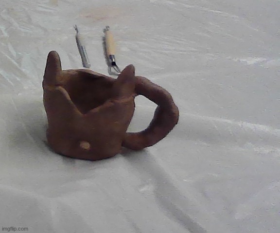 I made this in my art class out of clay its my first creation did I do a good job its a fox pitcher pot | made w/ Imgflip meme maker