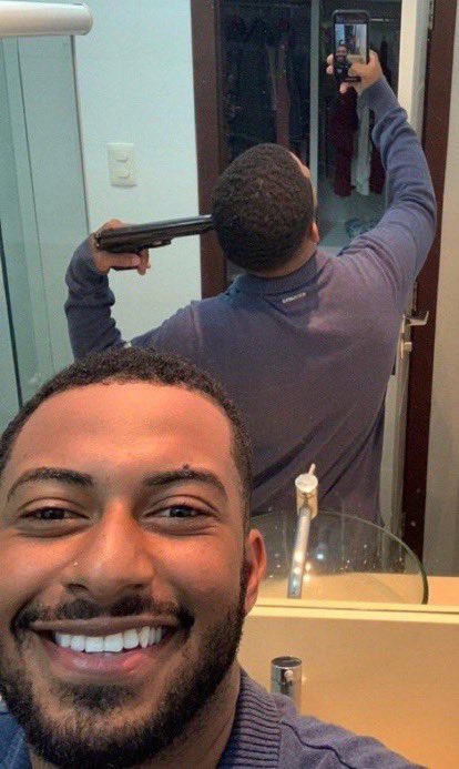 Guy in front of mirror with gun Blank Meme Template