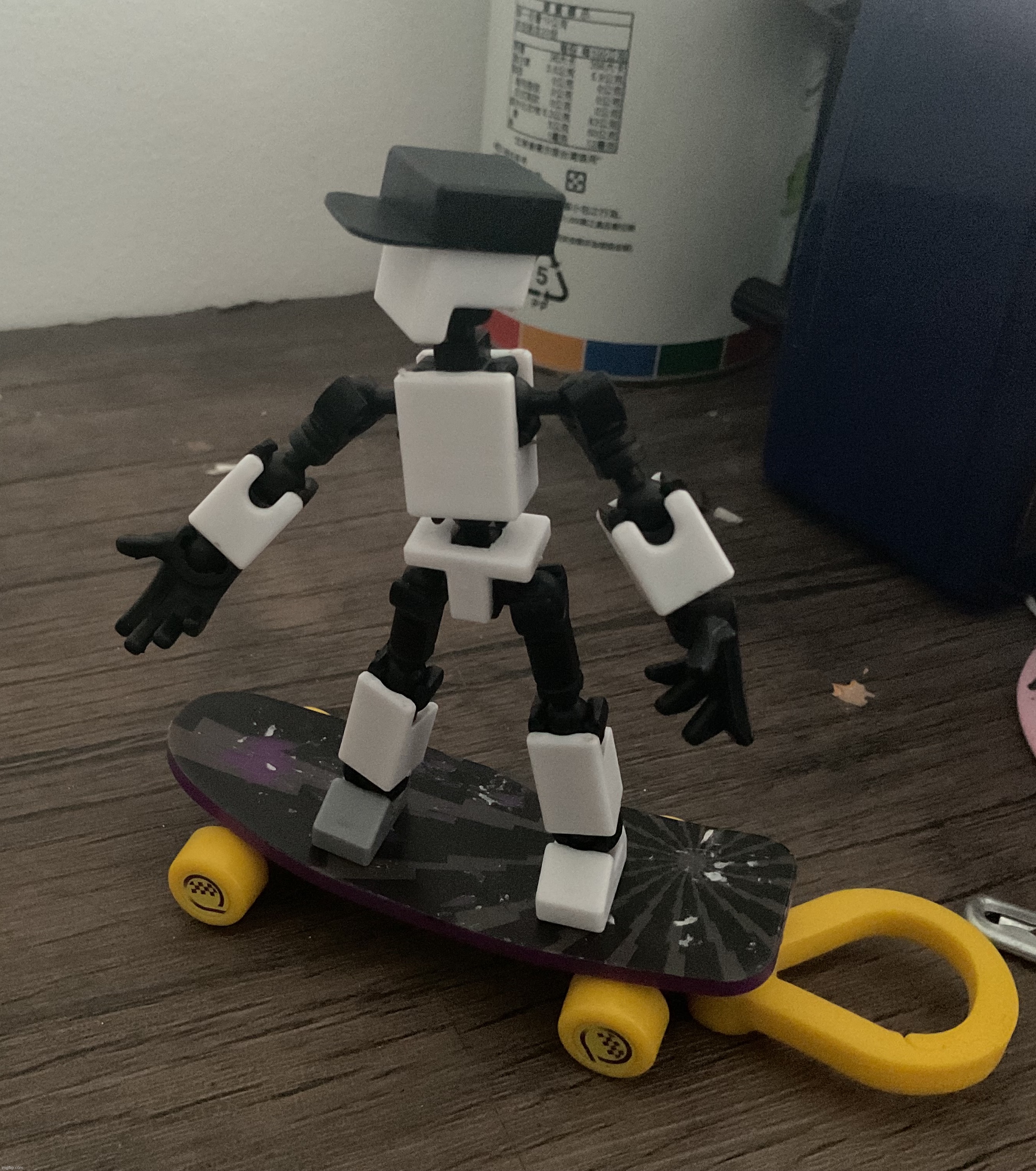 i found a fingerboard for shiro and kuro but it can turn into a keychain | made w/ Imgflip meme maker