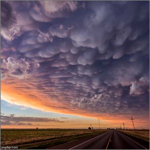 A Mammatus Cloud Formation | image tagged in clouds | made w/ Imgflip meme maker