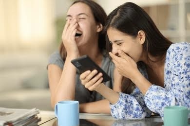 Girls laughing at phone Blank Meme Template