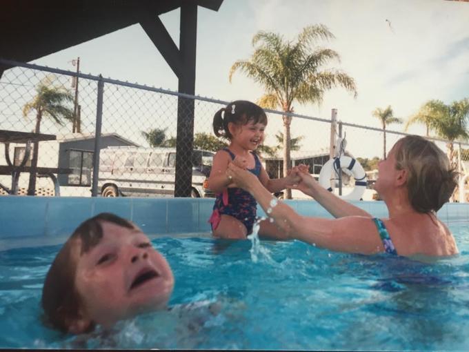 Mother ignoring drowning kid in pool Blank Meme Template