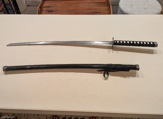 W or L Christmas present? | image tagged in sword,katana,y r u looking at tags nerd | made w/ Imgflip meme maker