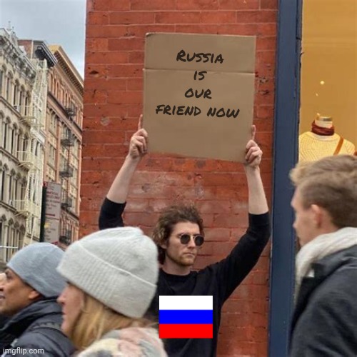 Man Holding Cardboard Sign | Russia is our friend now | image tagged in man holding cardboard sign | made w/ Imgflip meme maker