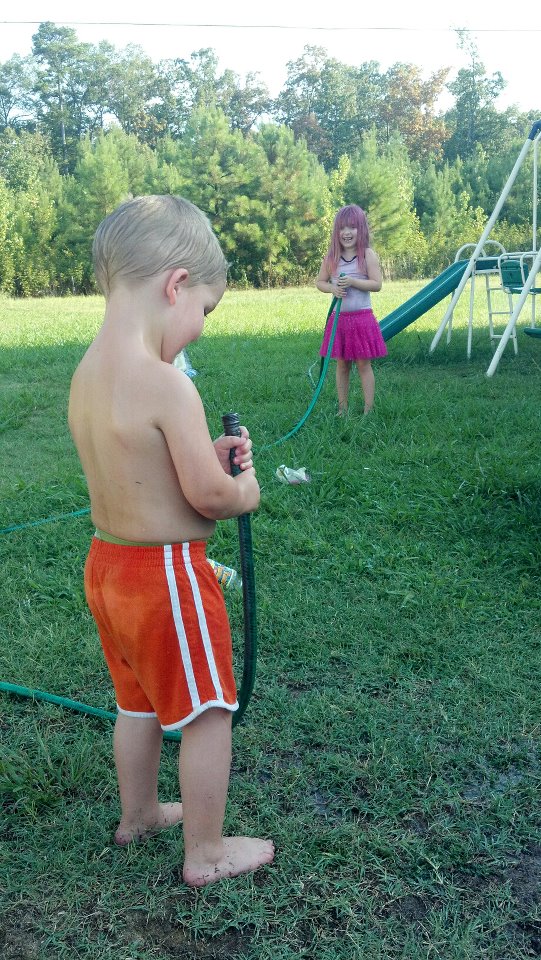 Children playing with a garden hose Blank Meme Template