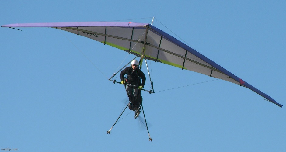 Powered gliding adventure soaring high above mountains