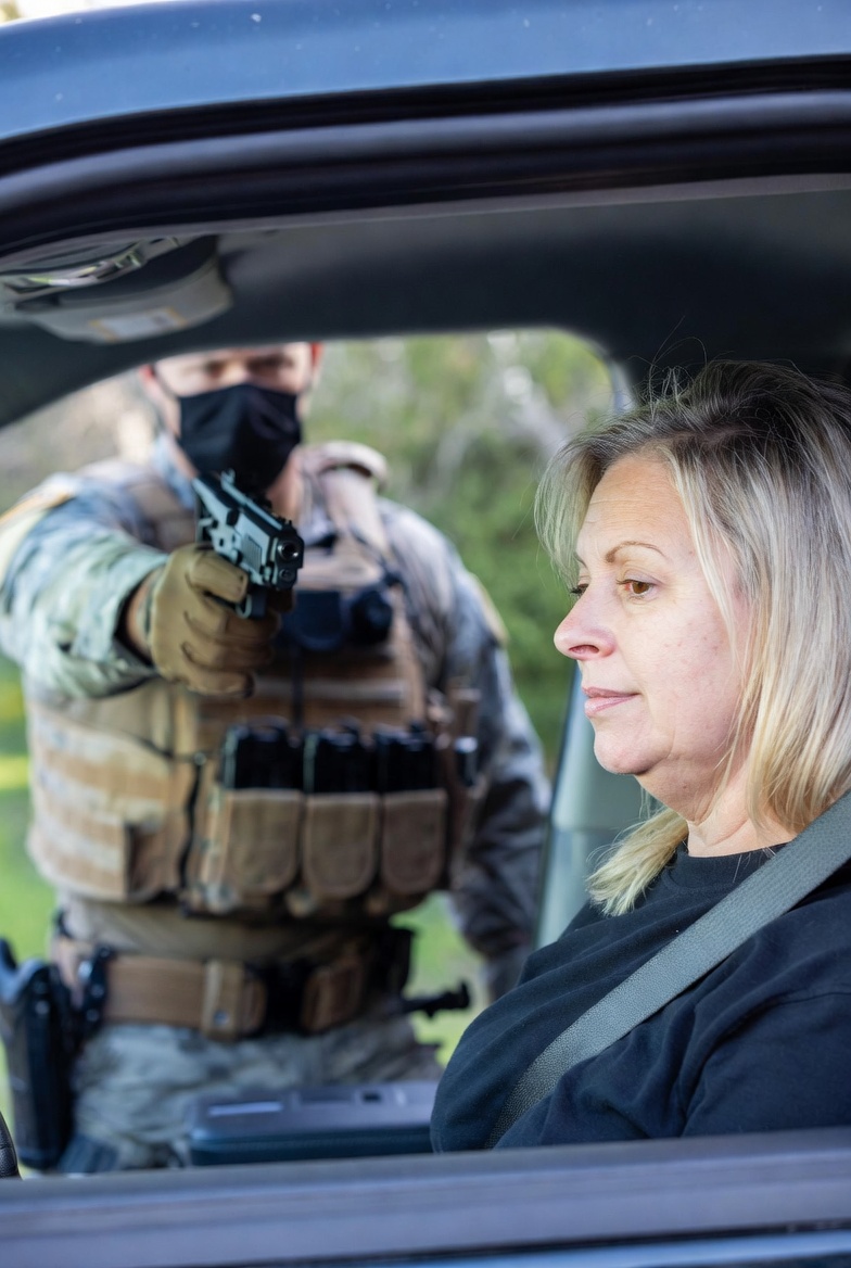 ICE agent threatening to shoot old woman Blank Meme Template