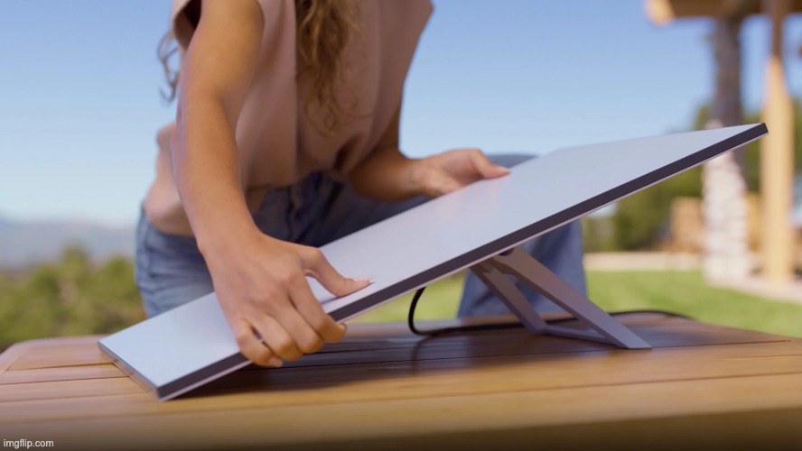 Farmer on tablet accessing satellite internet options