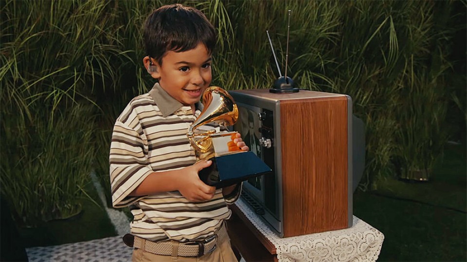 Kid receiving bad bunny's grammy Blank Meme Template