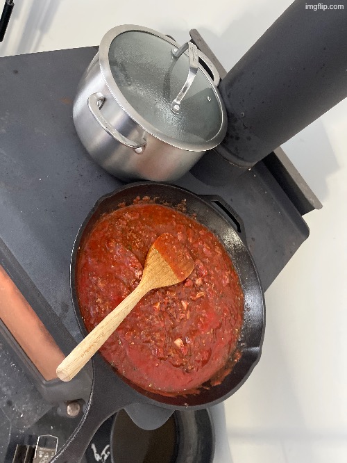 Cooking Pasta with lions mane in a cast iron pan on a wood stove | made w/ Imgflip meme maker