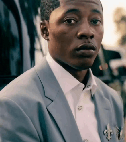 black suit guy staring Blank Meme Template