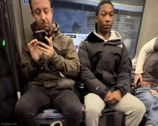 just 2 people on a train, one with a phone | made w/ Imgflip meme maker