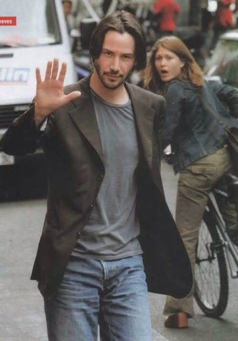 girl-riding-bike-looks-at-keanu-reeves Blank Meme Template