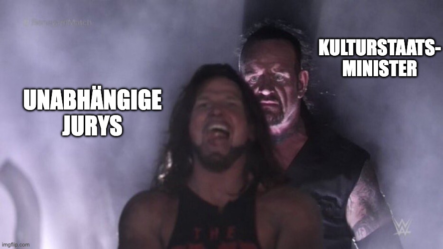 AJ Styles & Undertaker | Kulturstaats-
minister; Unabhängige Jurys | image tagged in aj styles undertaker | made w/ Imgflip meme maker