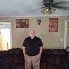 Guy standing next to fan Blank Meme Template