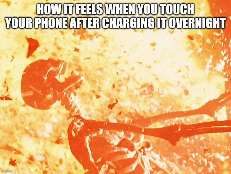 IT BURNS | How it feels when you touch your phone after charging it overnight | image tagged in fire skeleton | made w/ Imgflip meme maker